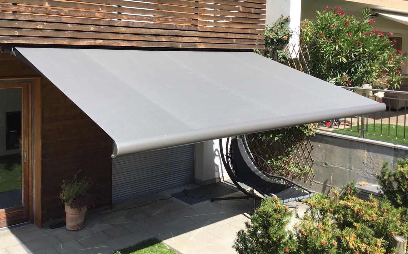 yuki folding arm awning in small outdoor area