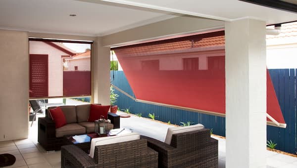 drop arm awnings on classic home