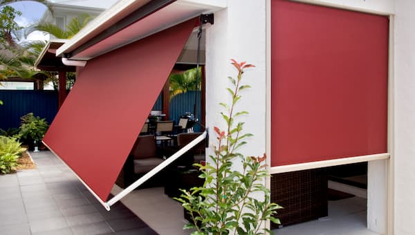 drop arm awning on classic home