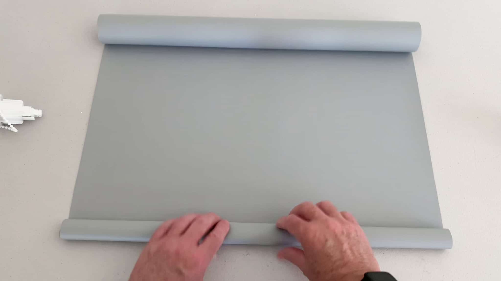 change roller blind from back to front